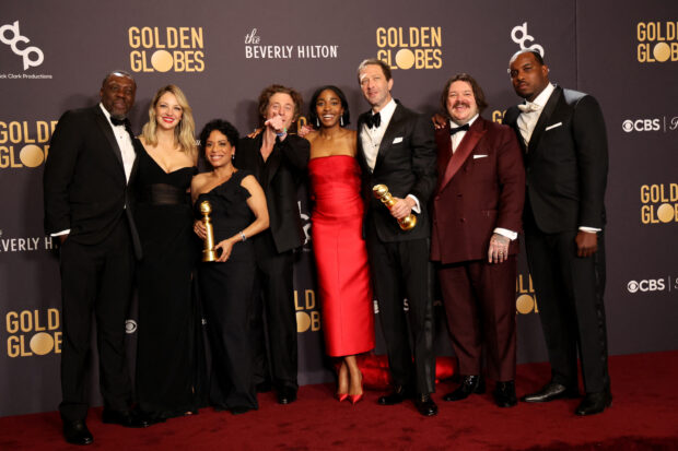 Jeremy Allen White, Ayo Edebiri, Matty Matheson, Ebon Moss-Bachrach, Lionel Boyce, Edwin Lee Gibson and Abby Elliott pose with the award for Best Television Series Musical or Comedy for "The Bear" at the 81st Annual Golden Globe Awards in Beverly Hills, California, U.S., January 7, 2024. REUTERS/Mario Anzuoni