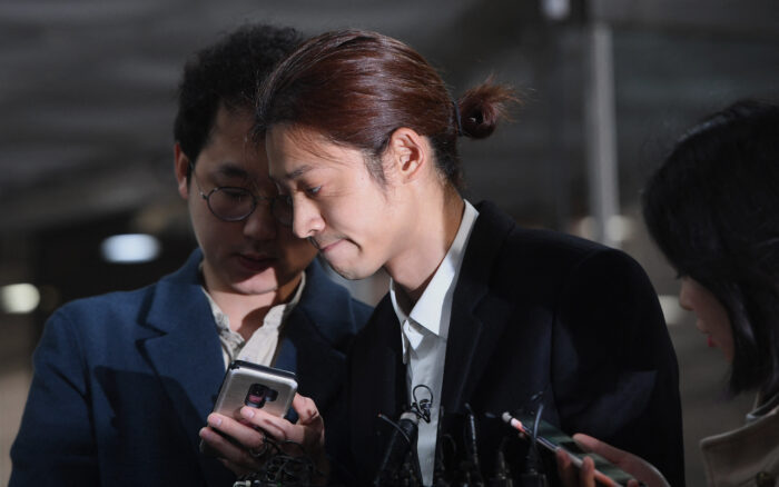 Ex-K-pop star Jung Joon-young leaves jail after 5-year rape, spycam term | Jung Joon-young (center) arrives to attend a hearing on his arrest warrant at the Seoul central district court in Seoul on March 21, 2019. Image: AFP/Jung Yeon-je