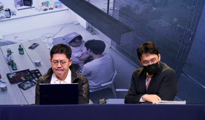 Spire Entertainment claims Omega X member sexually harassed former CEO | Hwang Seong-woo, CEO of Spire Entertainment (left), discloses a clip of a surveillance camera that shows Lee Hwi-chan, a member of Omega X, touching former CEO Kang Seong-hee inappropriately at a press conference in Seoul. Image: Newsis via The Korea Herald