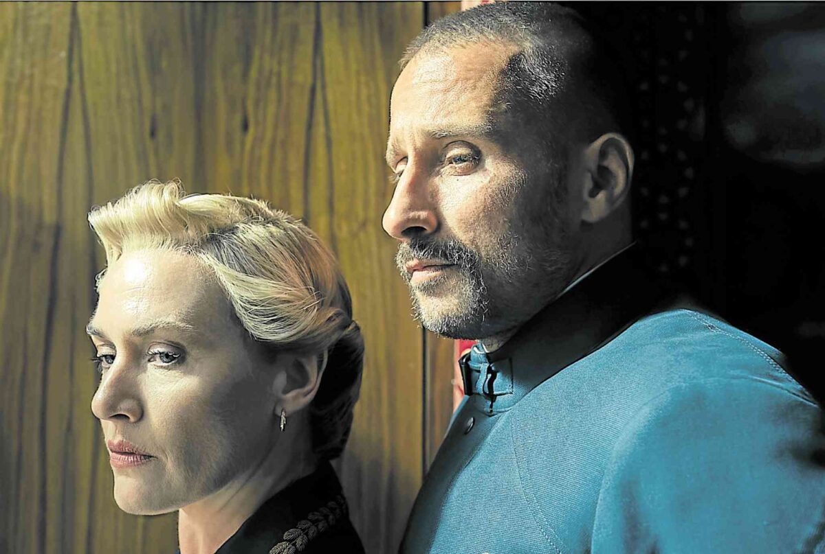 Kate Winslet (left) and Matthias Schoenaerts in “The Regime”