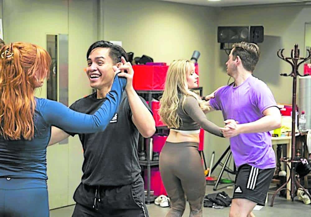 Iroy Abesamis (second from left) rehearsing for “Guys and Dolls”