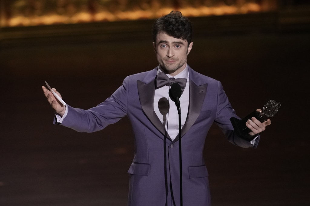 Daniel Radcliffe accepts the award for best performance by an actor in a featured role in a musical for "Merrily We Roll Along" during the 77th Tony Awards on Sunday, June 16, 2024, in New York. (Photo by Charles Sykes/Invision/AP)