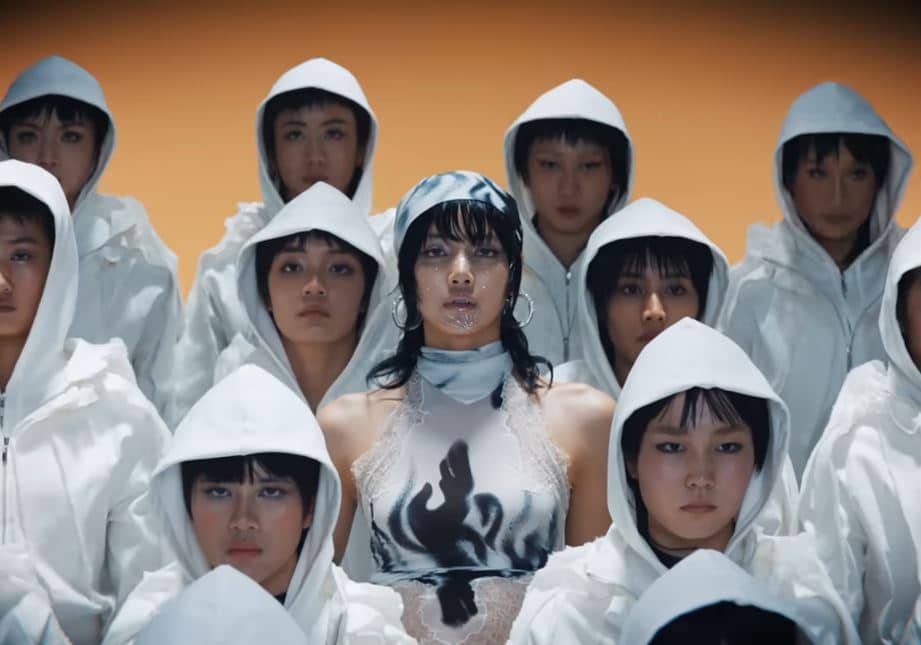 Lisa (center) in a scene from "Rockstar's" music video. Image: Sony Music Entertainment Korea via The Korea Herald