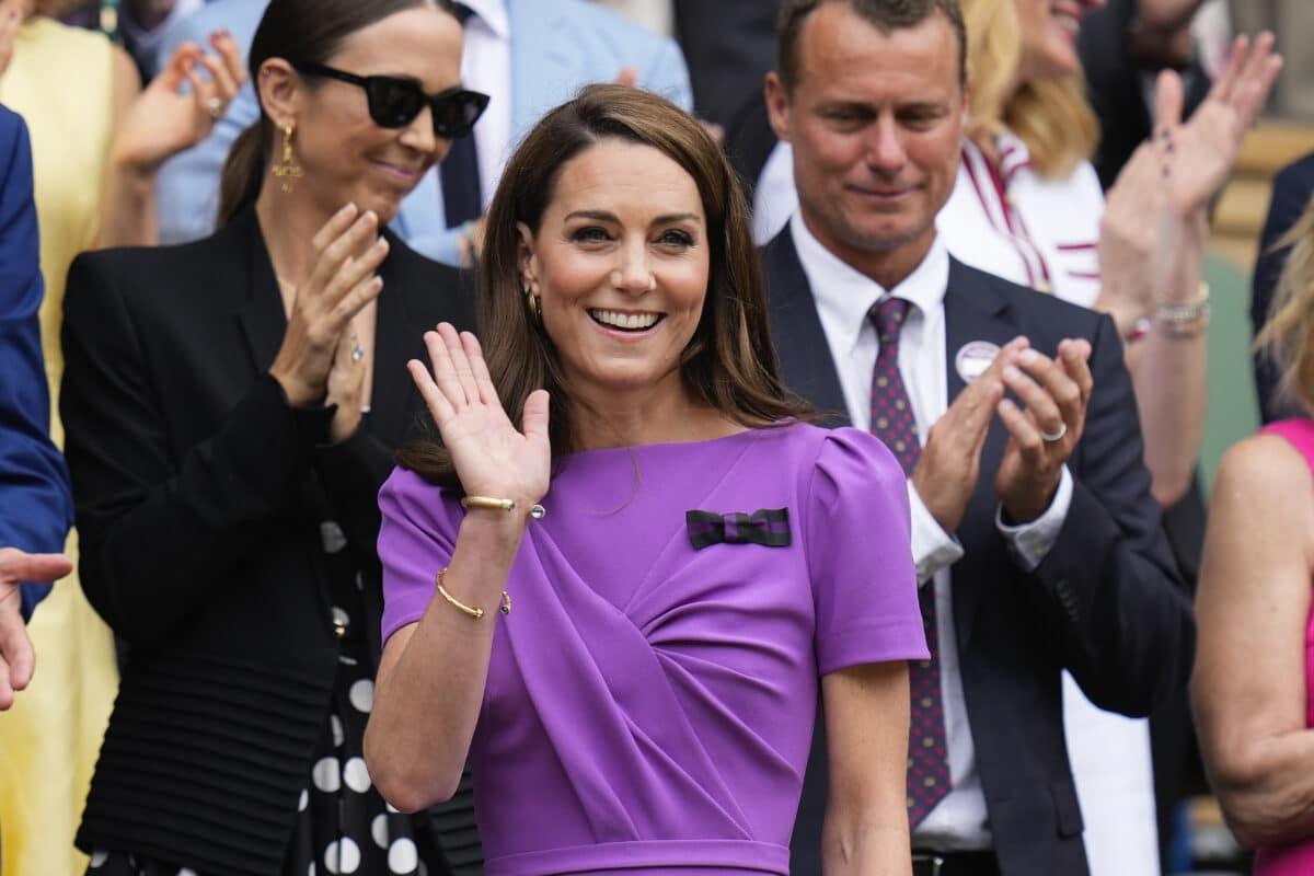 Kate Middleton, Princess of Wales waves as she arrives on Centre Court ahead of the men's singles final at the Wimbledon tennis championships in London, Sunday, July 14, 2024