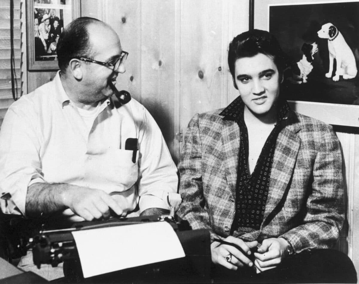 Elvis Presley (left) with Tom Parker