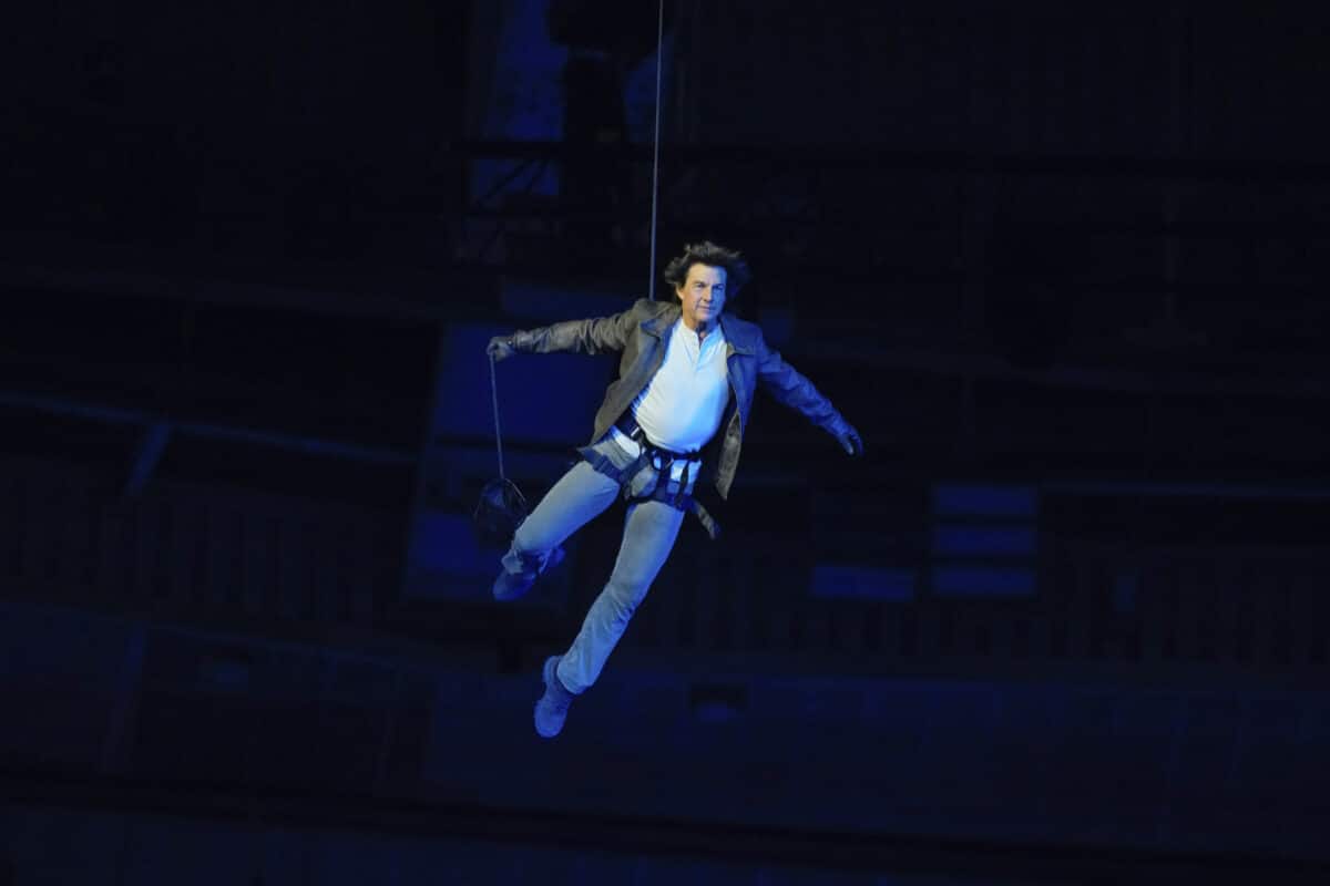 Tom Cruise is lowered on the Stade de France during the 2024 Summer Olympics closing ceremony, Sunday, Aug. 11, 2024, in Saint-Denis, France. Image: AP/Natacha Pisarenko