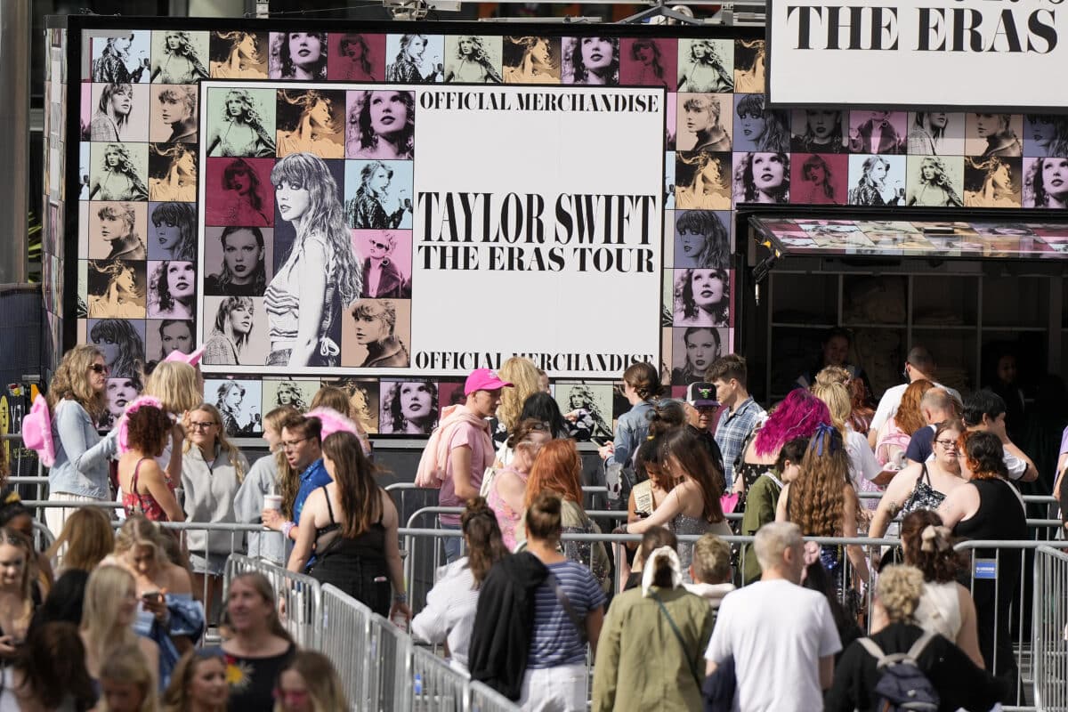 Fans of singer Taylor Swift, called Swifties, arrive at Wembley Stadium in London, Thursday, Aug. 15, 2024 for the first of five concerts of Taylor Swift's Eras Tour. Image: AP Photo/Alastair Grant