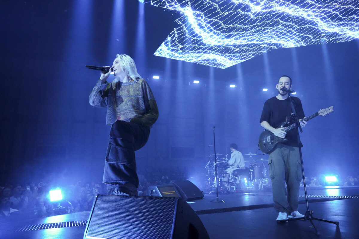 Emily Armstrong, from left, Colin Brittain, and Mike Shinoda of Linkin Park