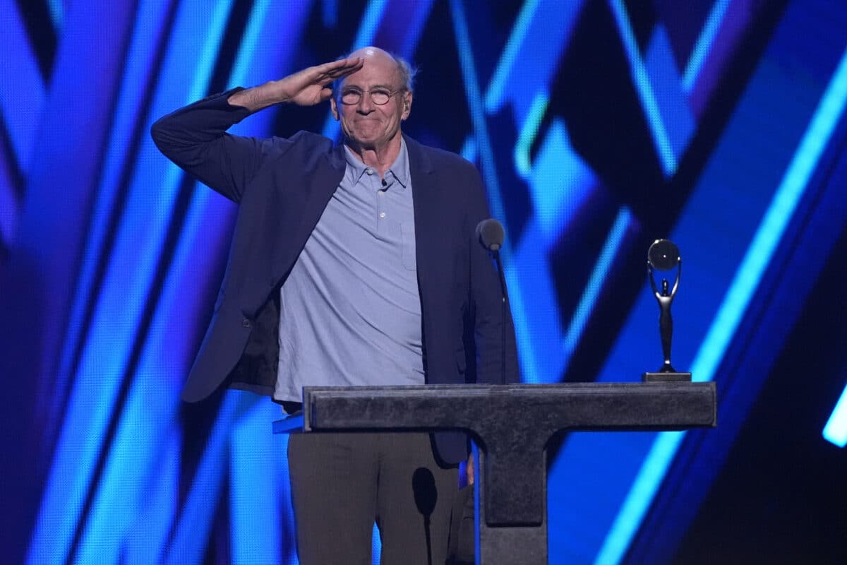 James Taylor speaks about the late Jimmy Buffett during the 39th Annual Rock & Roll Hall of Fame Induction Ceremony on Saturday, Oct. 19, 2024, at Rocket Mortgage FieldHouse in Cleveland. Image: AP/Chris Pizzello