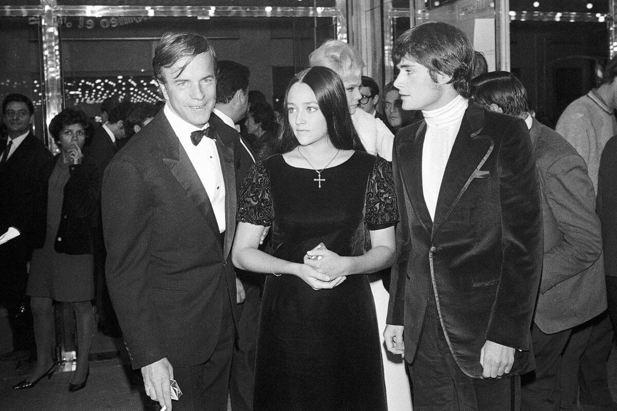 "Romeo and Juliet" movie director Franco Zeffirelli (left), actors Olivia Hussey (center), and Leonard Whiting are seen after the Parisian premiere of the film in Paris on Sept. 25, 1968. Image: AP Photo/Eustache Cardenas