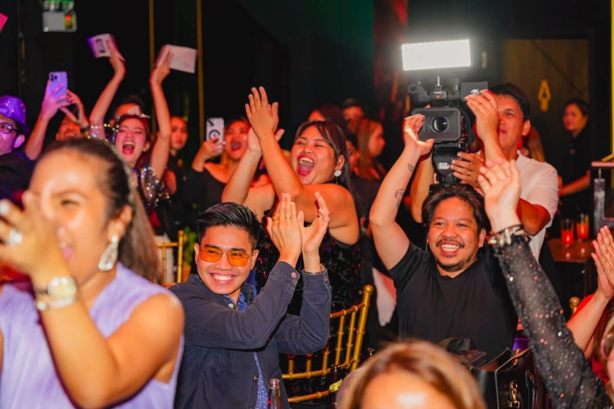 Media attendees cheers with smiles during the annual media christmas celebration.