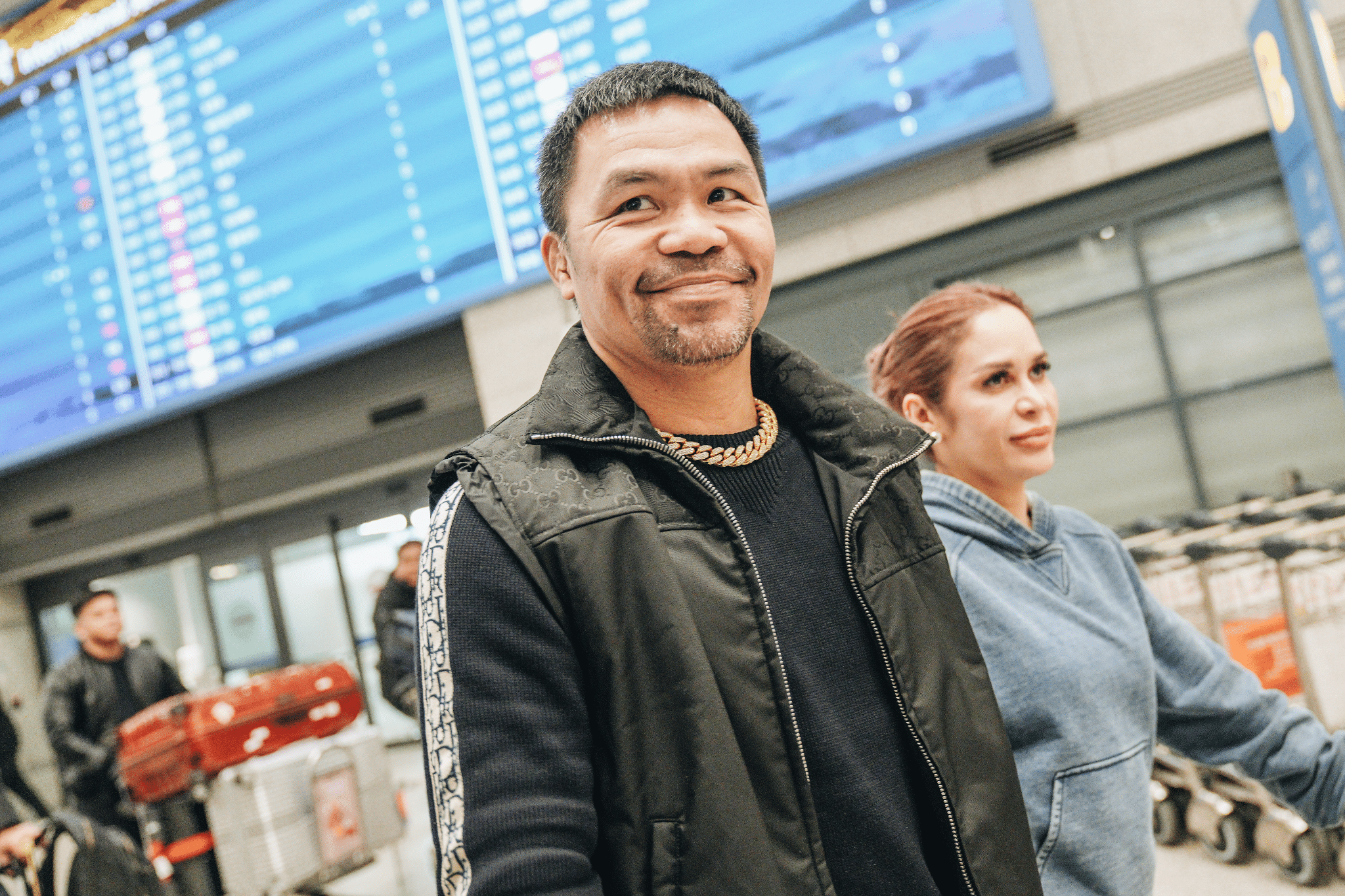 Manny Pacquiao and his wife Jinkee Pacquiao at an airport in South Korea. Image: Courtesy of Netflix