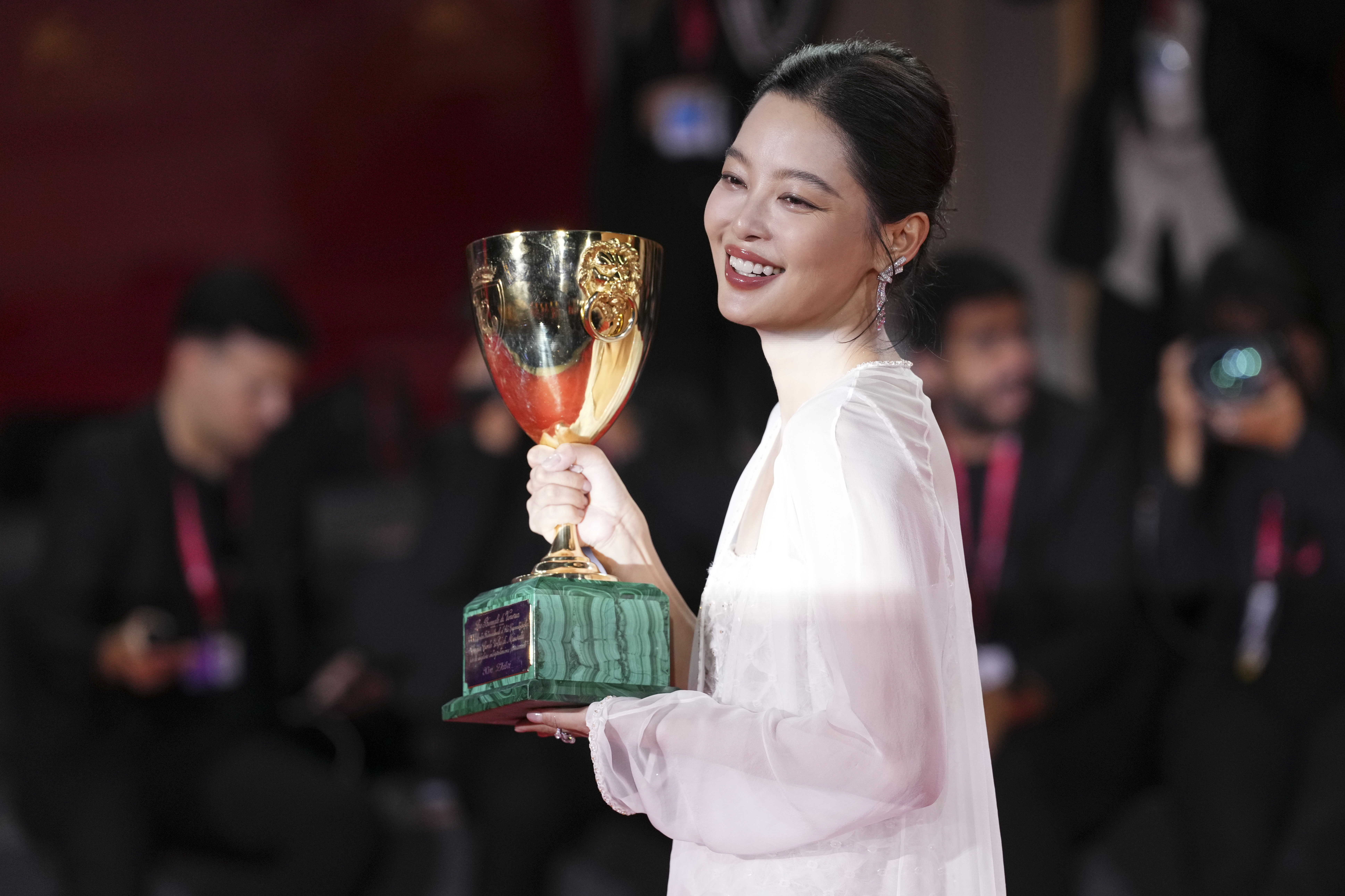 Xin Zhilei, winner of the Coppa Volpi Award for best actress for 'The Sun Rises on US All', poses for photographers during the Prices Photo call during the 82nd edition of the Venice Film Festival in Venice, Italy, on Saturday 6 September 2025. Image: SCOT/INVIT/AP